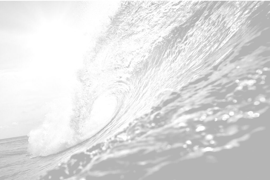 Faded back black and white photo of an ocean wave crashing