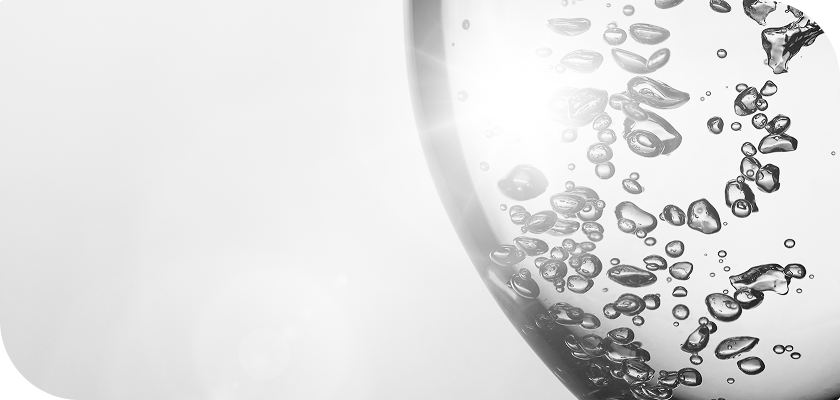 An abstract image featuring bubbles within a round shape and a light flare