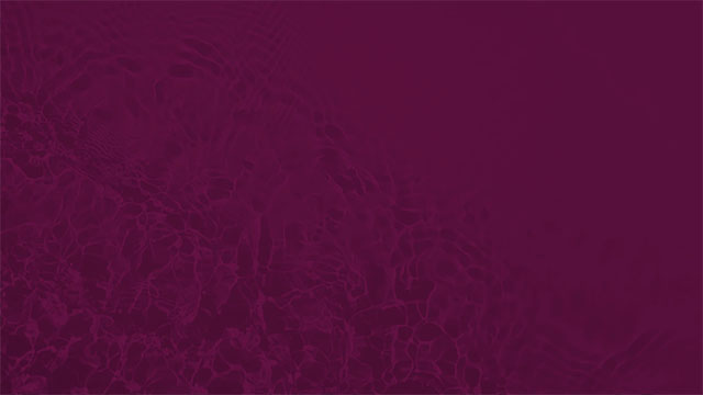 Overhead shot of gentle waves with burgundy overlay