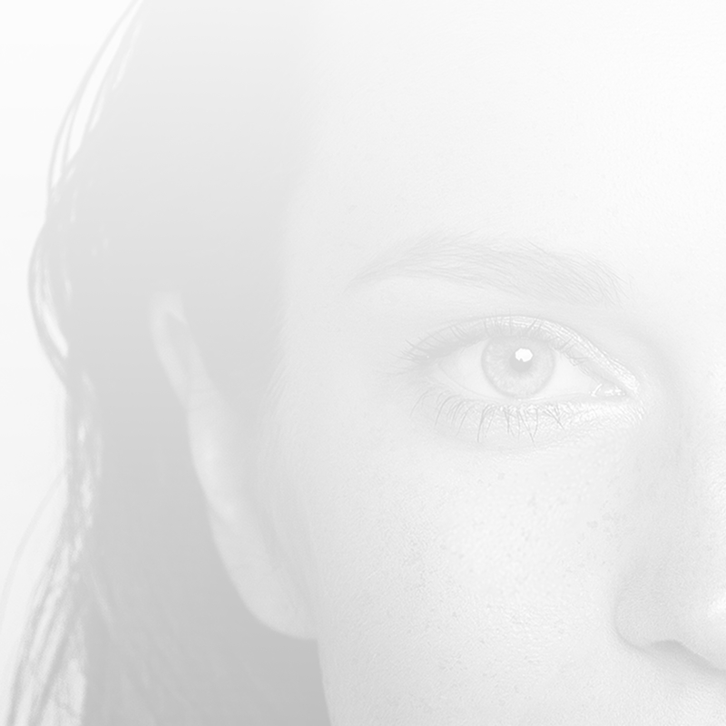 Faded back black and white closeup of the side of a woman's face